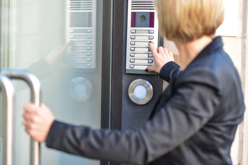Office-lady-entering-office-via-intercom-system